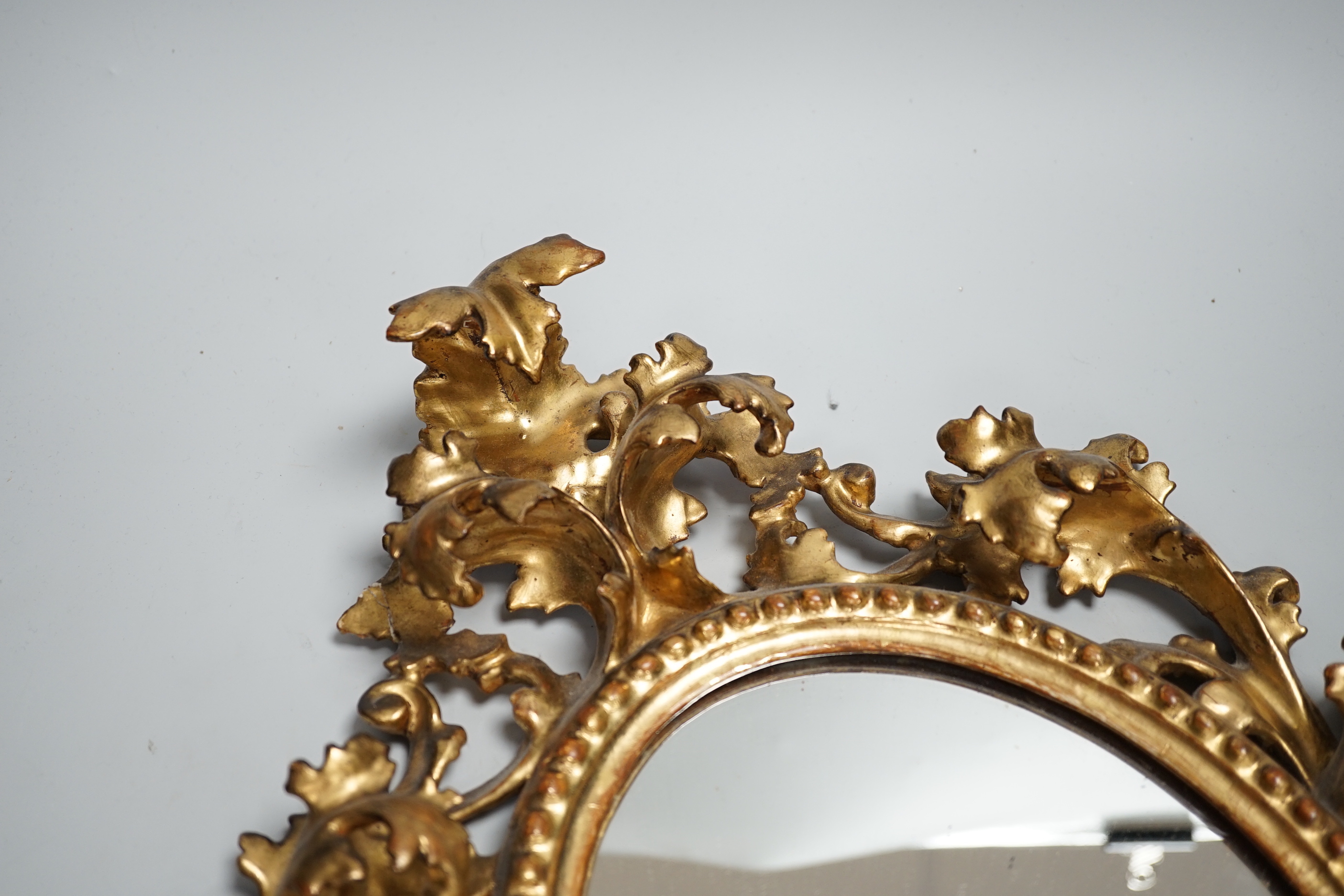 A late 19th century Florentine giltwood mirror, 43cm